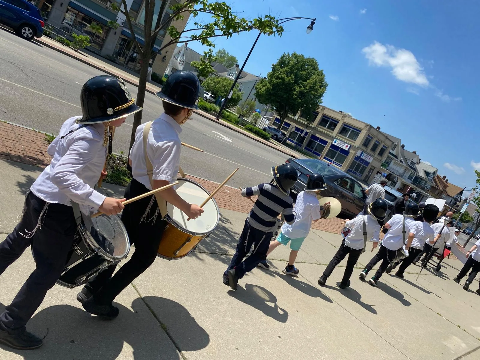 A drum corps marching in the parade