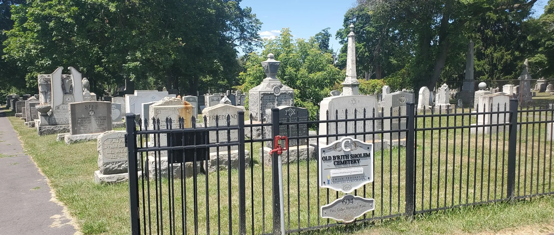 The Old Bris Shalom Cemetery behind its iron fence