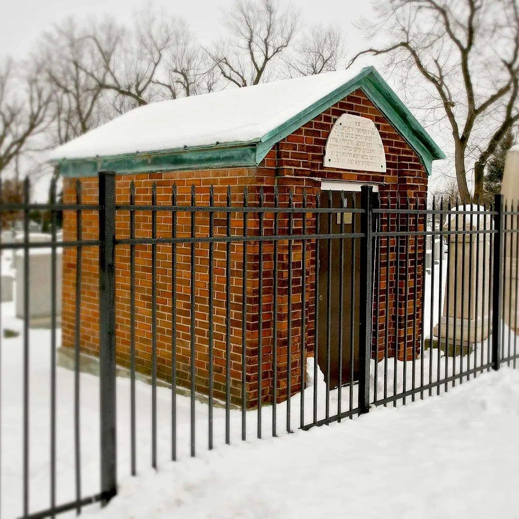 The brick ohel of Rabbi Rabinowitz in the snow